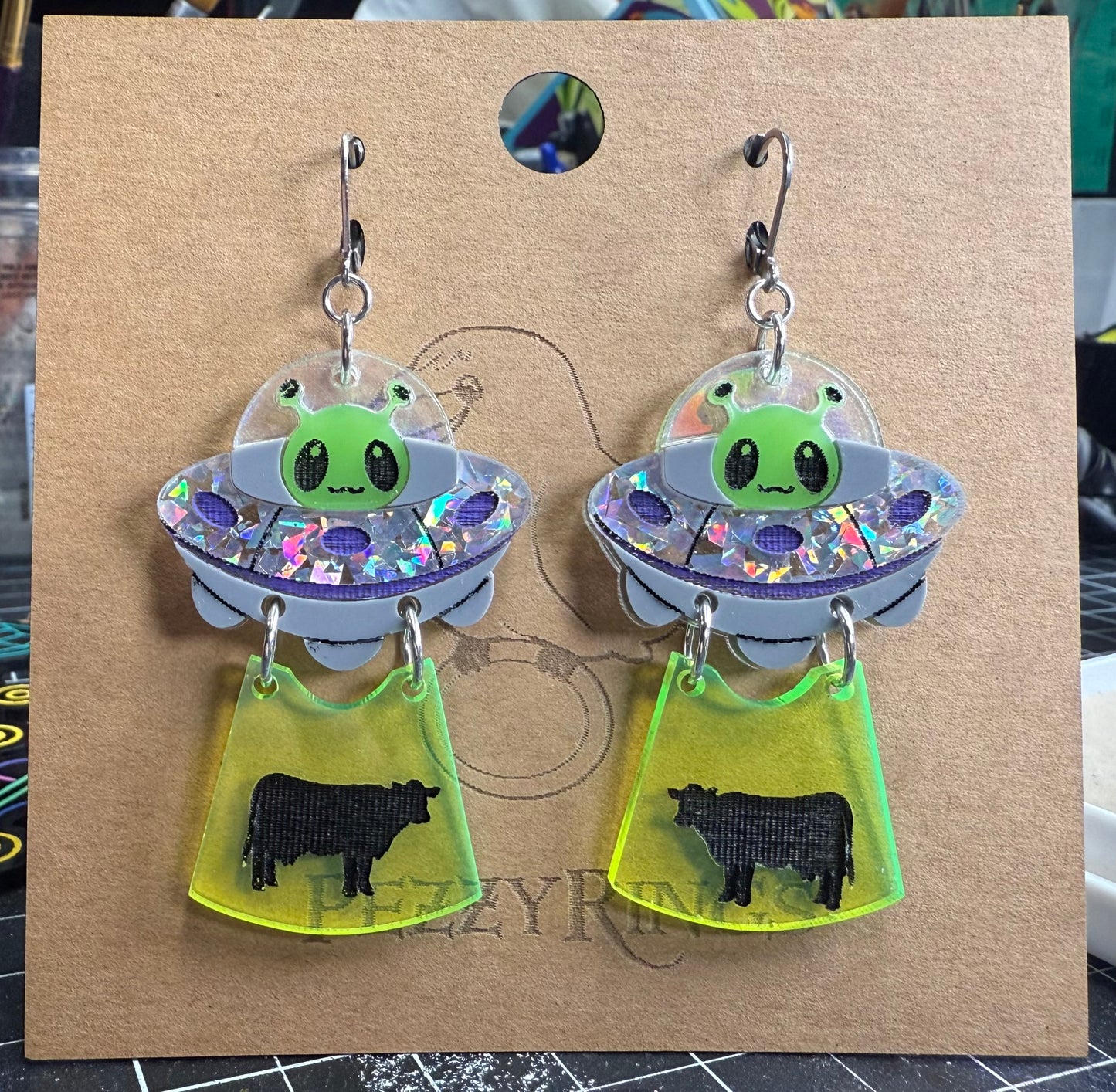 Alien earrings cow