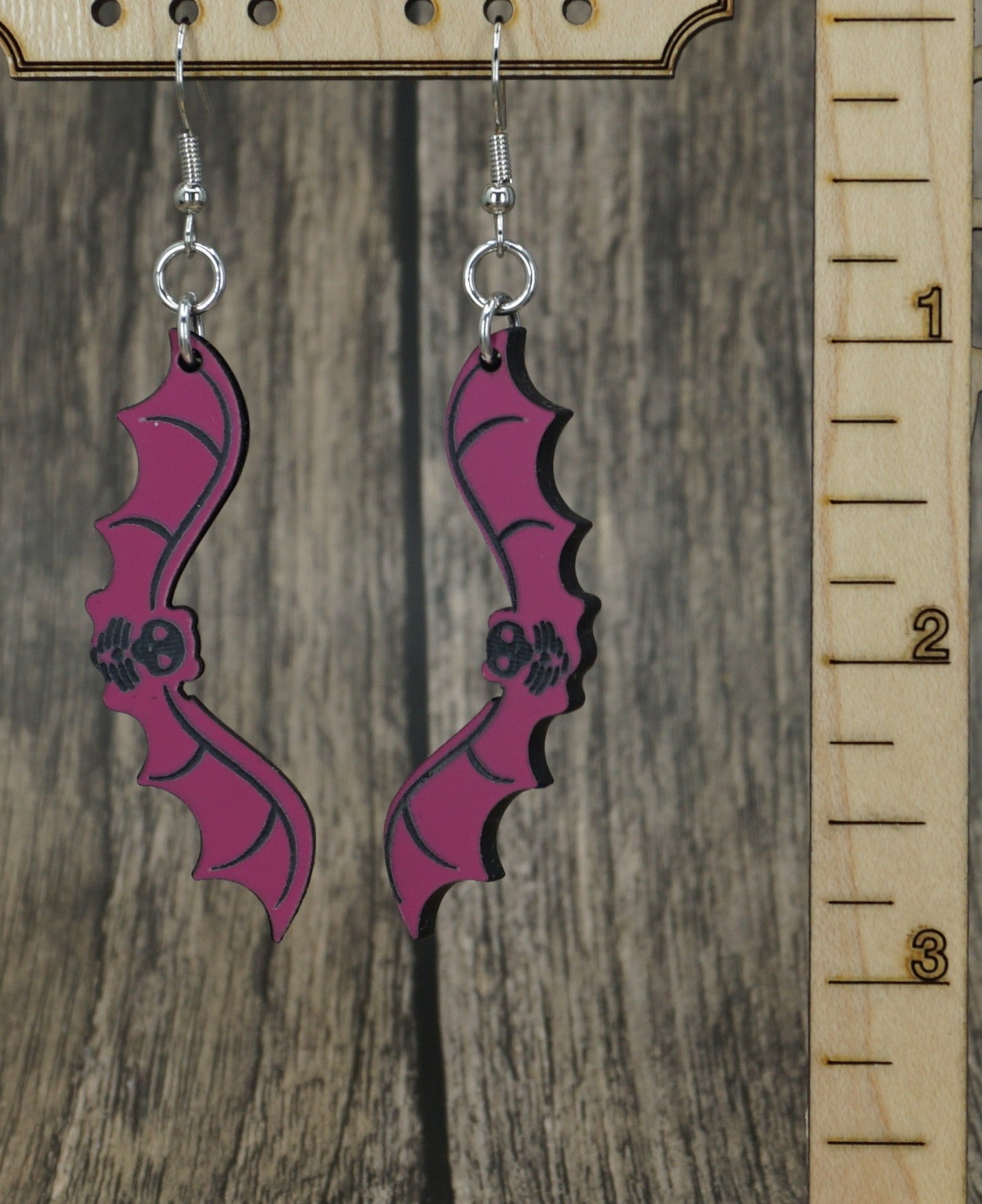 pink and black bat earrings