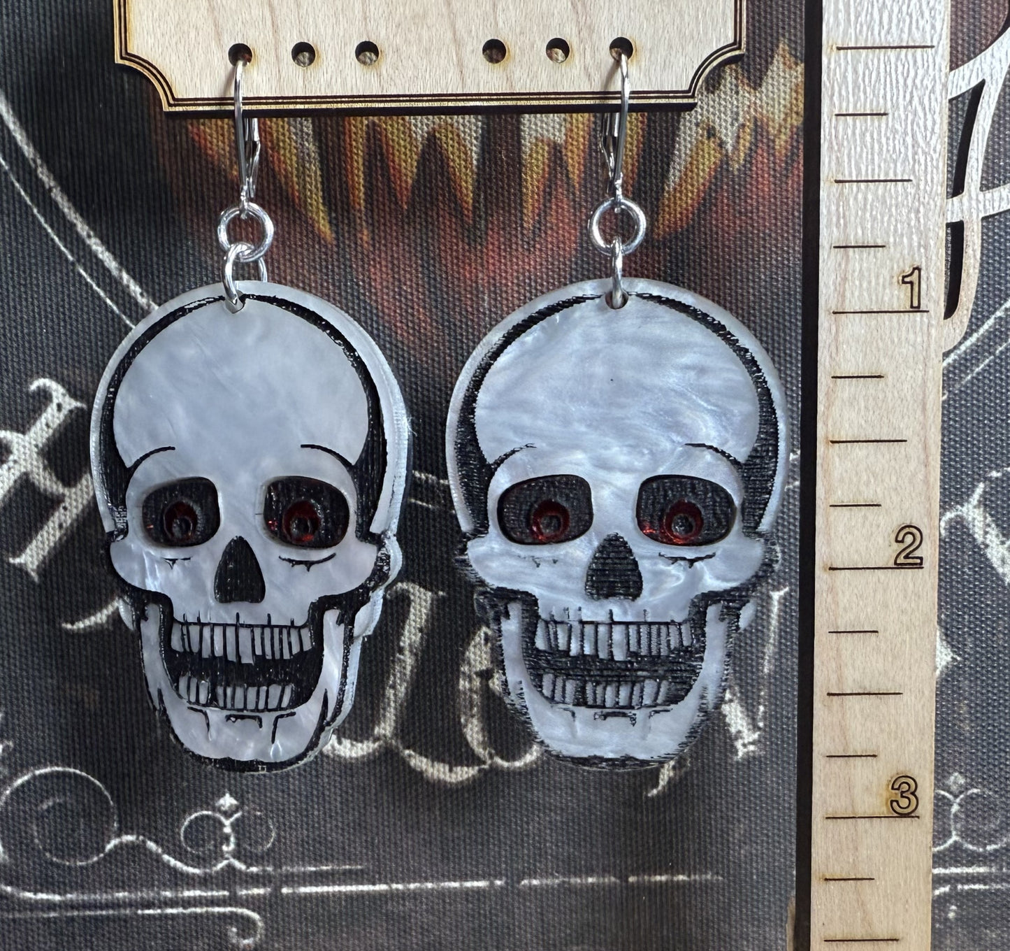 Red eyed skull earrings