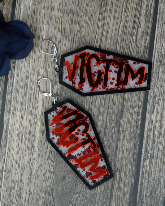 victim coffin earrings