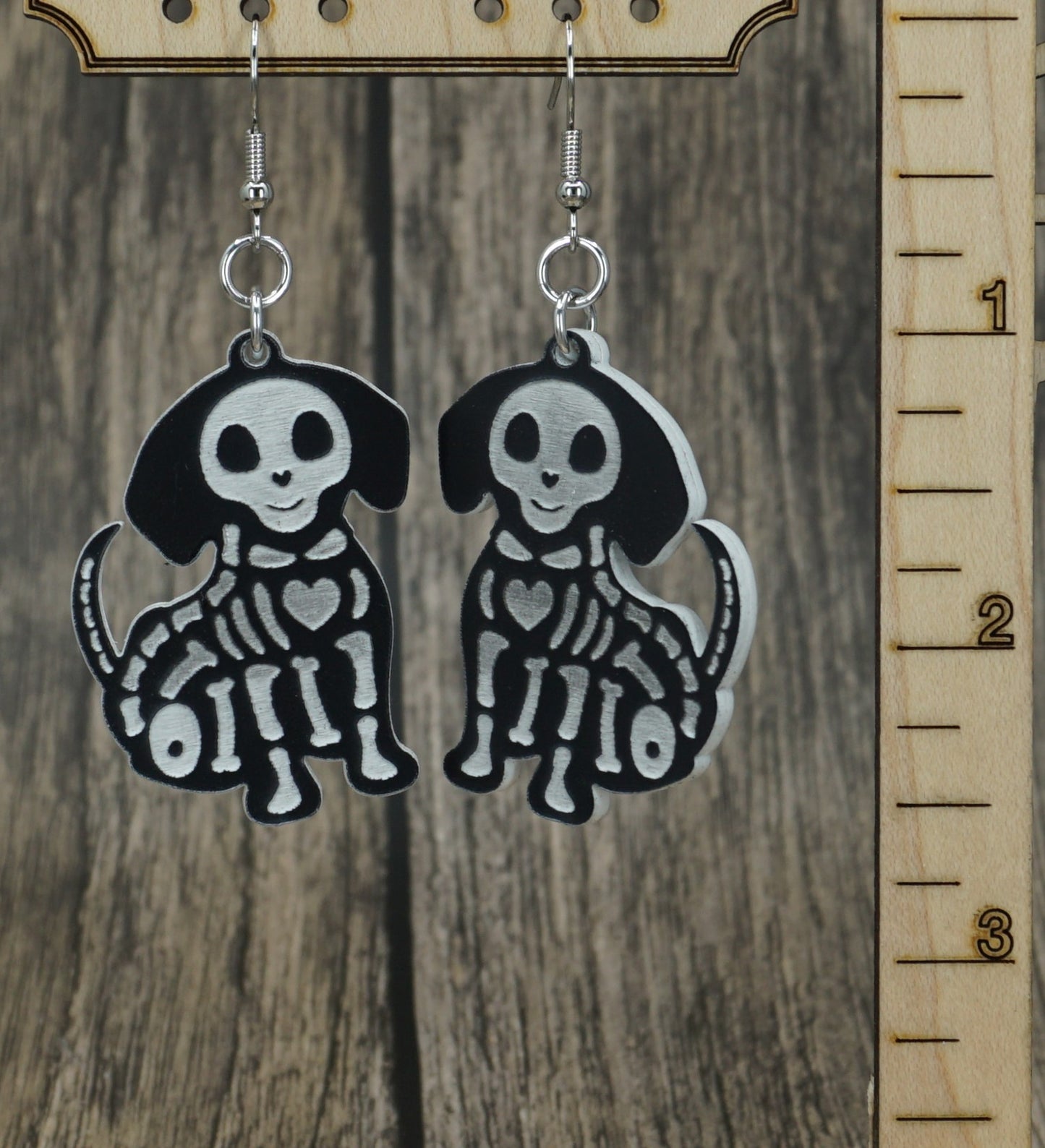 black and white small dog skeleton earrings
