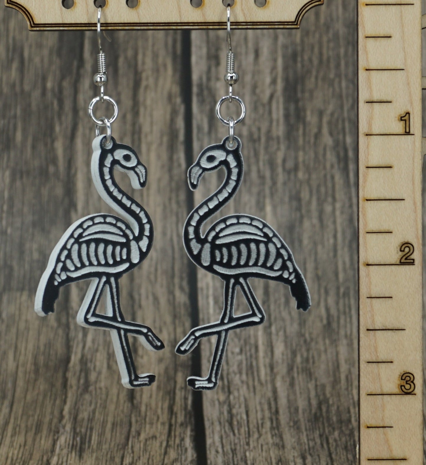 Black and white flamingo skeleton earrings