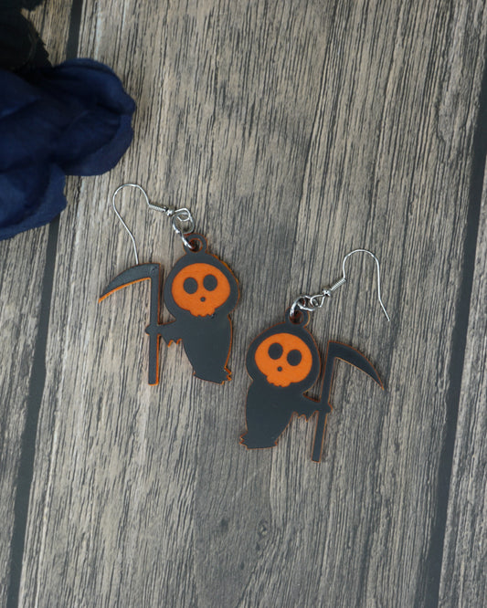 black and orange grim reaper earrings