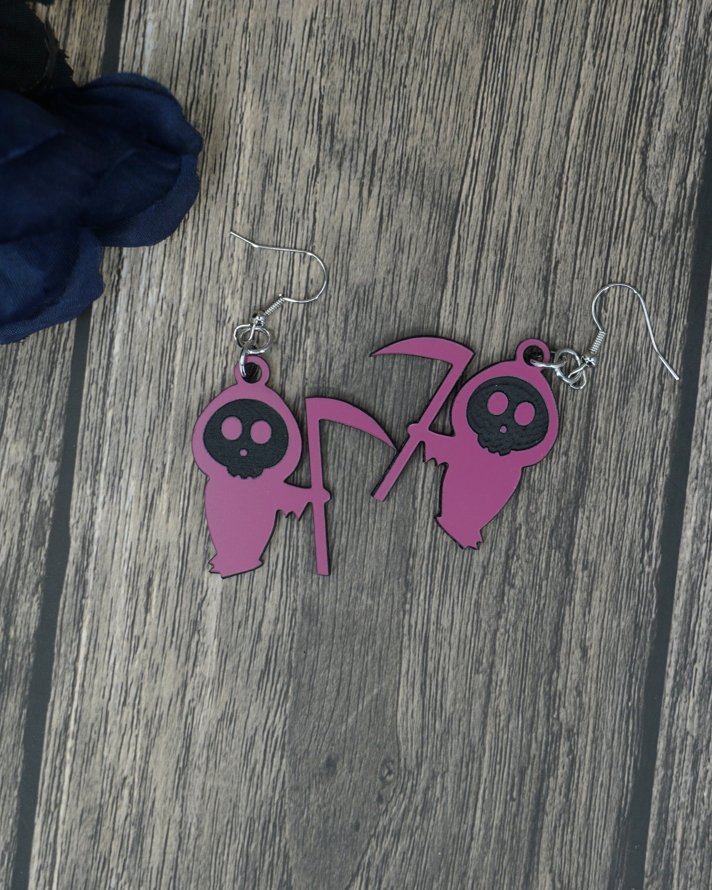 pink and black grim reaper earrings